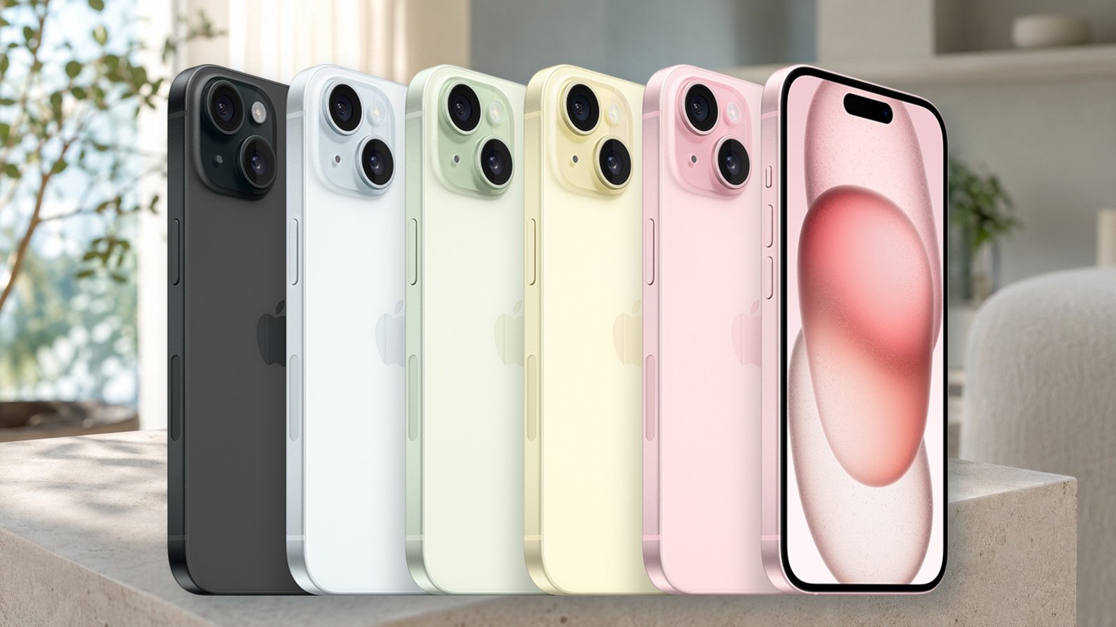 Gamme iPhone 15 de plusieurs couleurs présentée sur une table dans un intérieur lumineux
